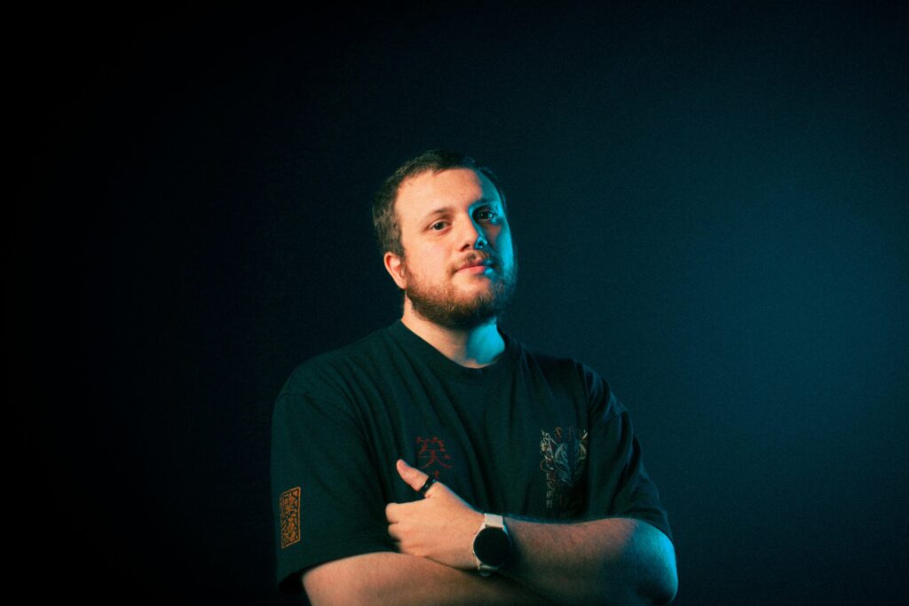 man with crossed arms and sad look symbolising losing one's self